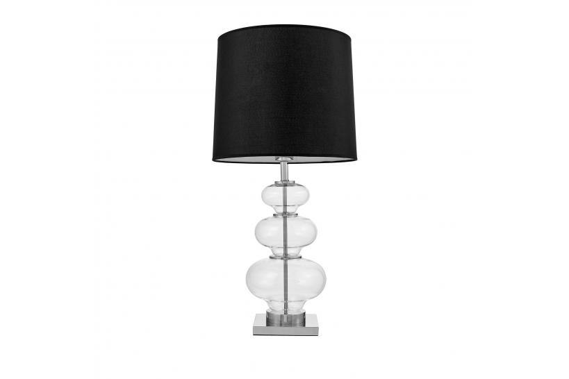 La lampada da tavolo o comodino BRISTON con paralume nero un mix di tre materiali vetro trasparente, metallo e tessuto ignifugo.