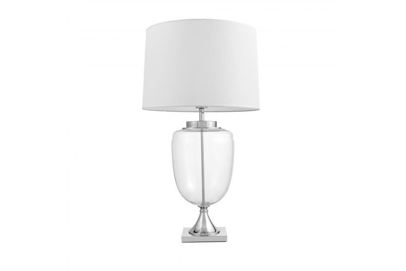 La lampada da tavolo o comodino OLIMPIA con paralume bianco un mix di 3 materiali vetro trasparente, metallo e tessuto ignifugo.