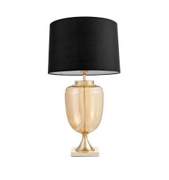 La lampada da tavolo o comodino OLIMPIA con paralume nero un mix di tre materiali vetro dorato, metallo e tessuto ignifugo.