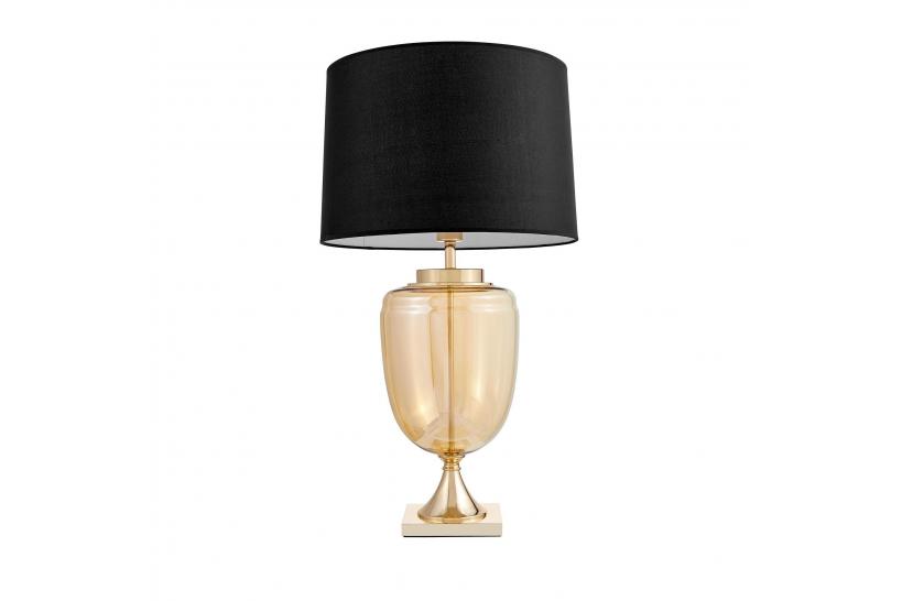 La lampada da tavolo o comodino OLIMPIA con paralume nero un mix di tre materiali vetro dorato, metallo e tessuto ignifugo. La lampada da tavolo o comodino OLIMPIA con paralume nero un mix di tre materiali vetro dorato, metallo e tessuto ignifugo.