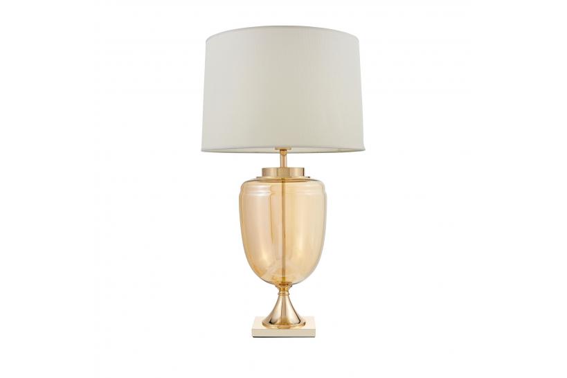 La lampada da tavolo o comodino OLIMPIA con paralume bianco un mix di tre materiali vetro dorato, metallo e tessuto ignifugo.